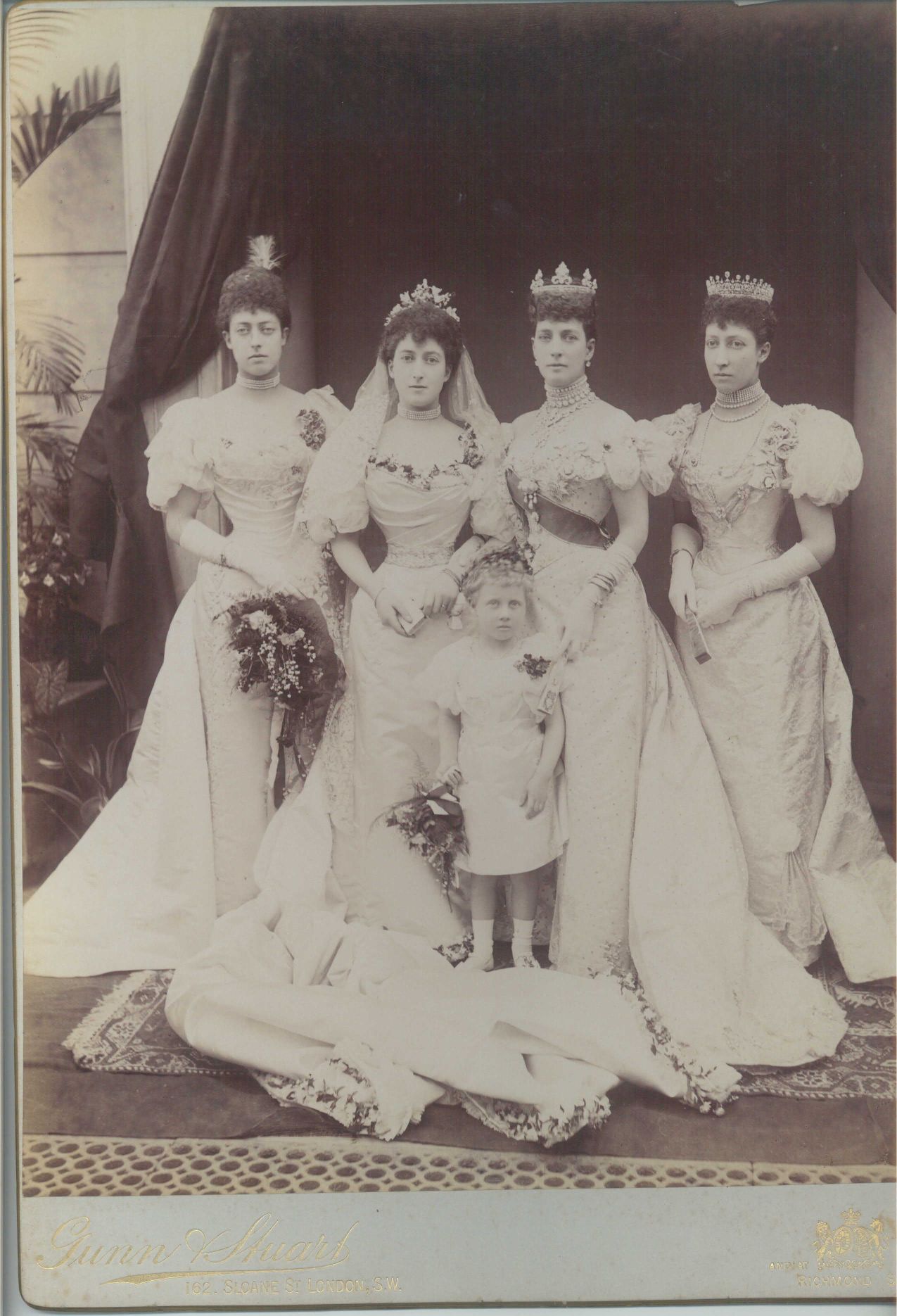(1869-1938, Queen of Norway) with her mother, ALEXANDRA( of Denmark, 1844-1925, his Queen), and her sisters LOUISE (1867-1931, Princess Royal) & VICTORIA ALEXANDRA (1868-1935, Princess) together with the oldest bridesmaid's daughter and flowergirl Lady Alexandra DUFF (1891-1959, created a Princess in 1905 by her grandfather Edward VII) — Sophie Dupré Autographs